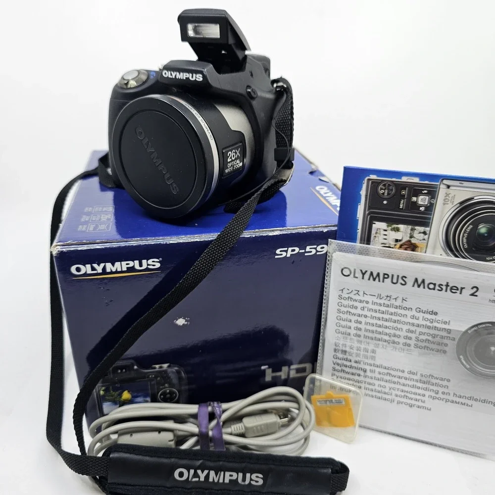 Olympus SP-590UZ 12.0MP Digital Bridge Camera Original Box w/Accessories SD